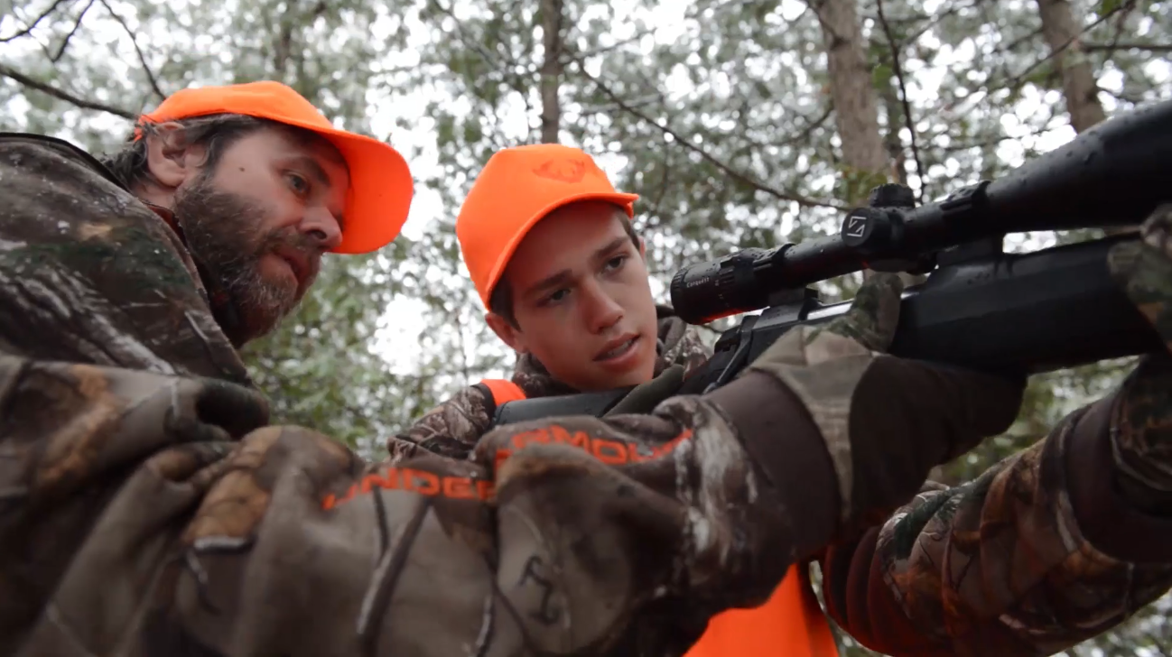 dad-and-son-hunting Dad showing son how to use a rifle